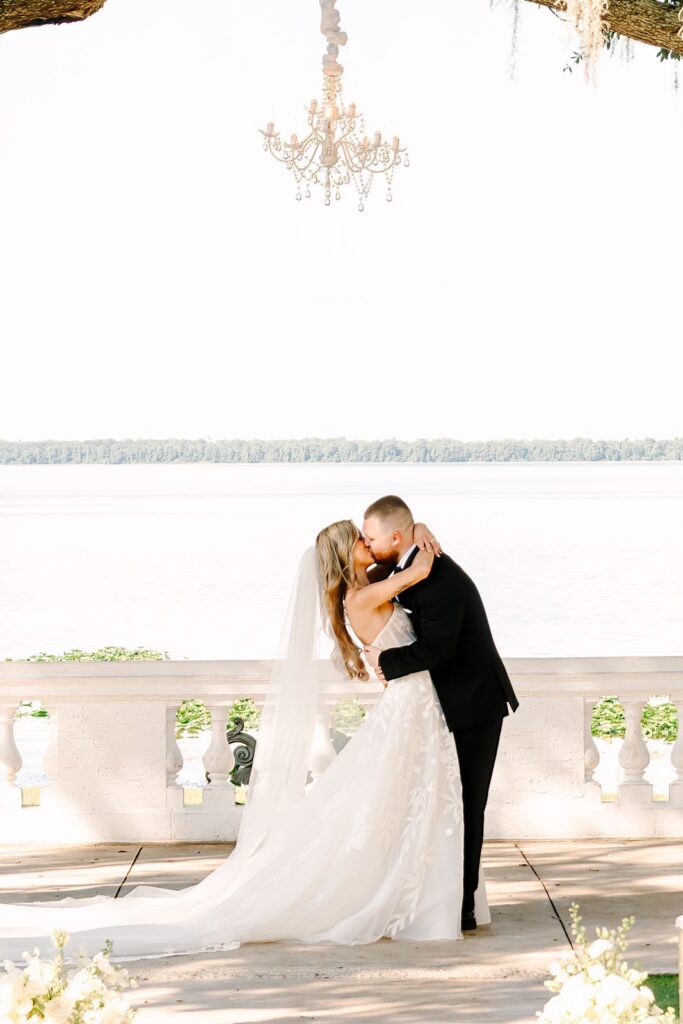 Bride and Groom first kiss at Bella Cosa Wedding venue