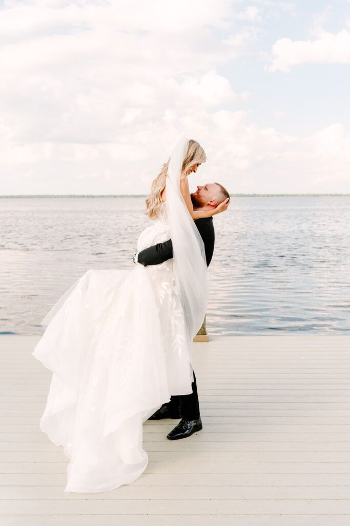 Bride and Groom dock portraits at Bella Cosa Wedding Venue