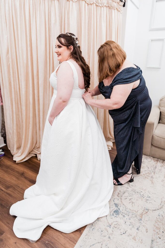 Bride getting into dress at the Granville Plantation
