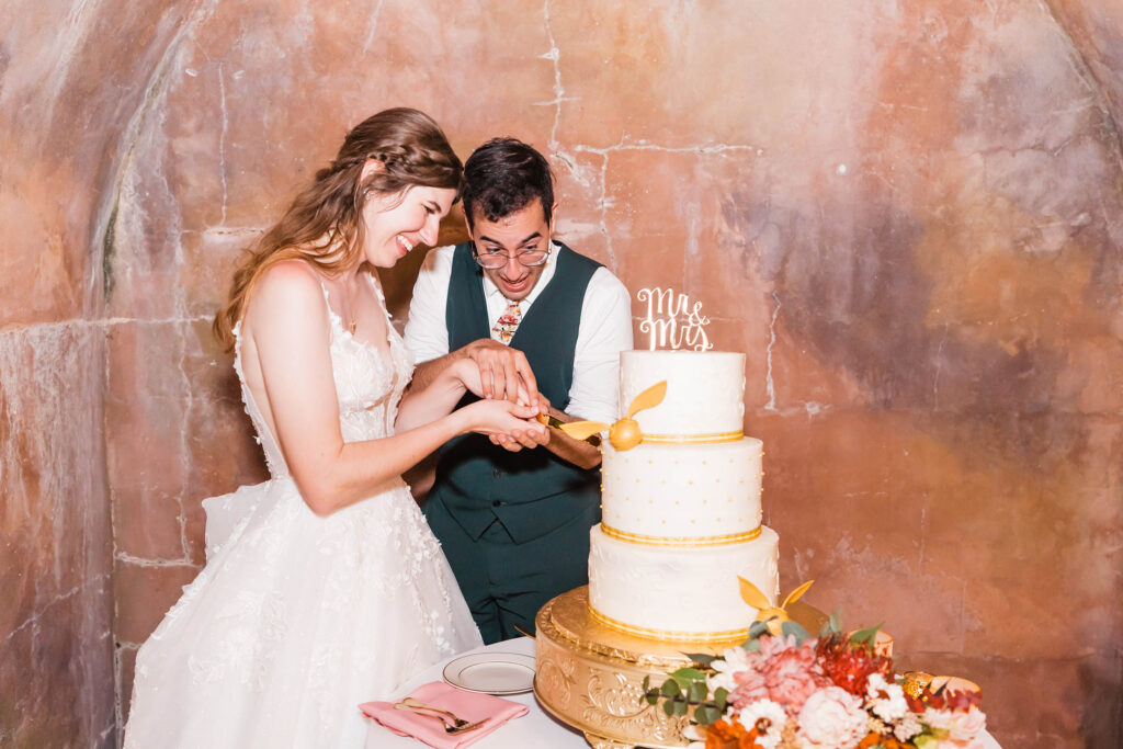 Bride and Groom cake cut at The Howey Mansion Wedding Venue 