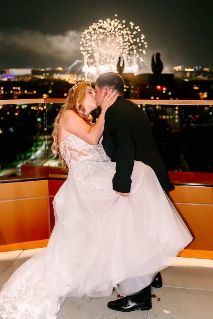 Bride and Groom dancing to fireworks at the Walt Disney World Swan Reserve
